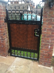 Wrought iron metal and timber gate